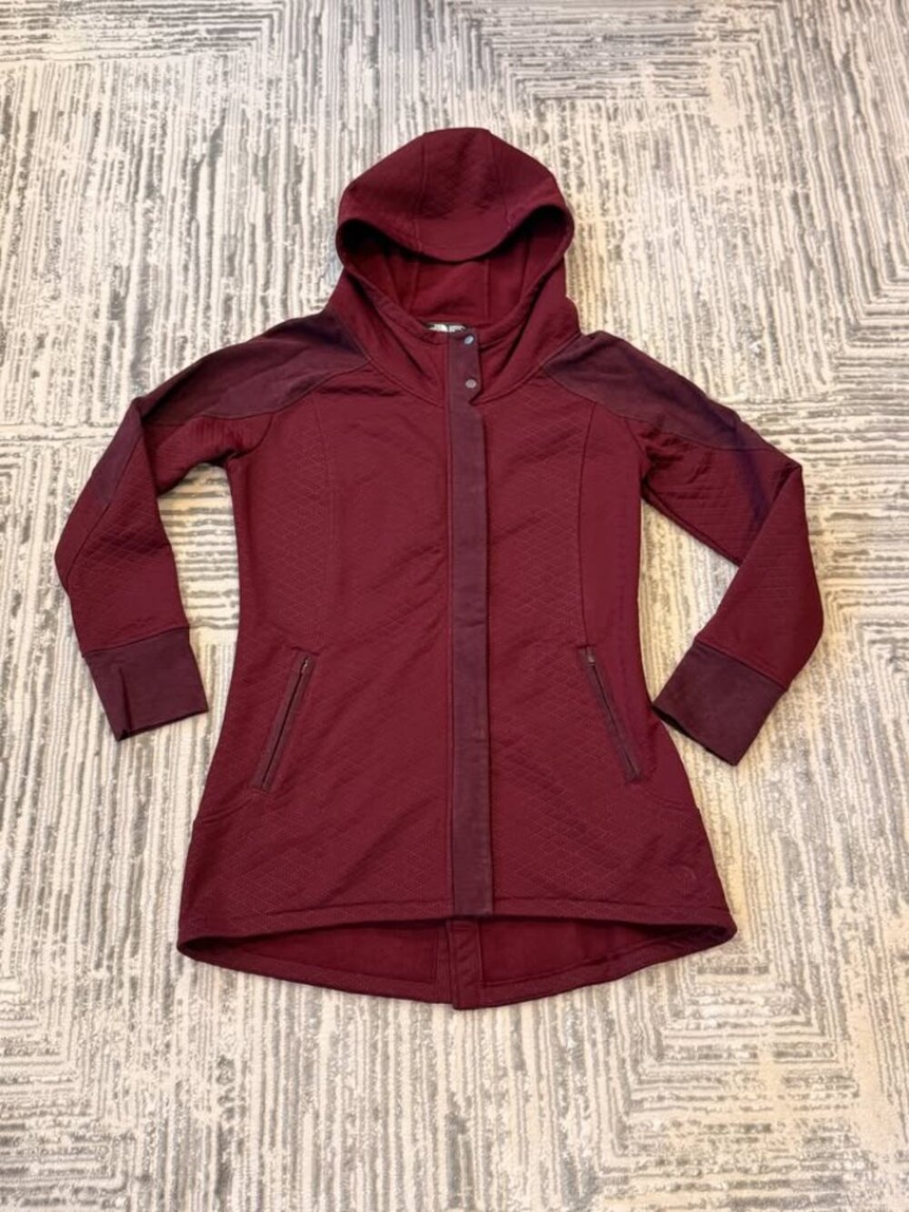 The North Face women's medium Burgundy 3/4 length coat. MSRP $225